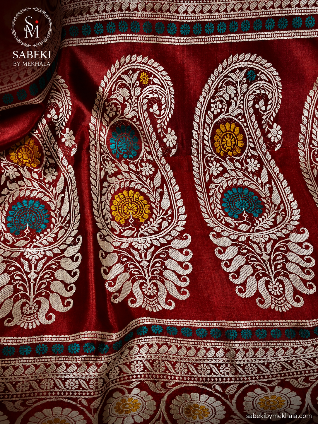 Burnt Red pure silk revival Baluchari saree featuring a triple-border Pachapere layout and Resham Meenakari paisley motifs by Sabeki By Mekhala.