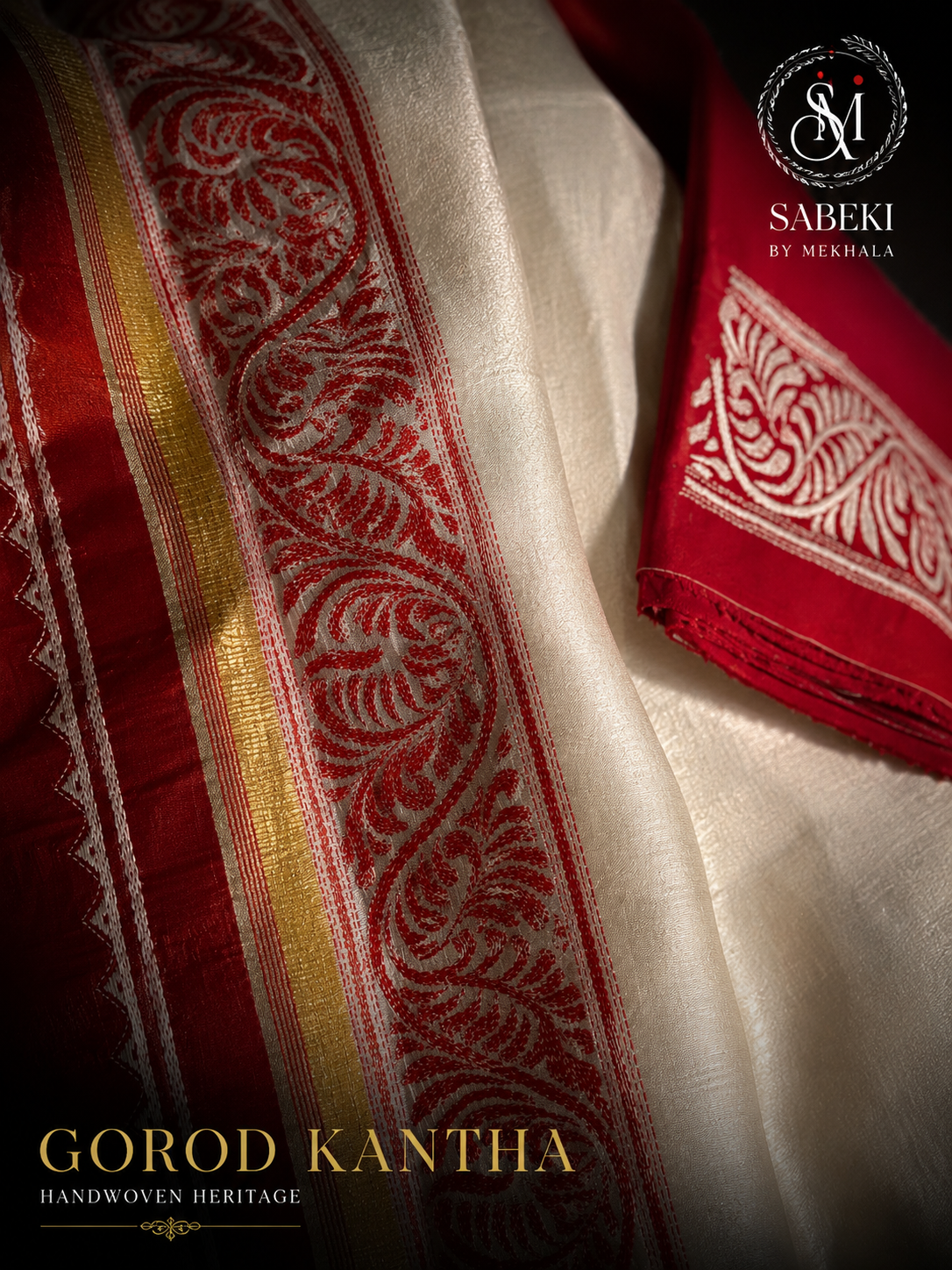 Close-up of crimson red Alpona Kantha hand embroidery on pure off-white Gorod silk saree with blouse