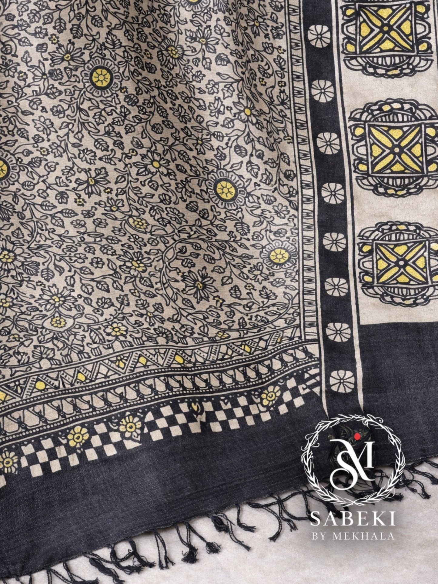 Close-up of hand-painted Madhubani artwork on silk