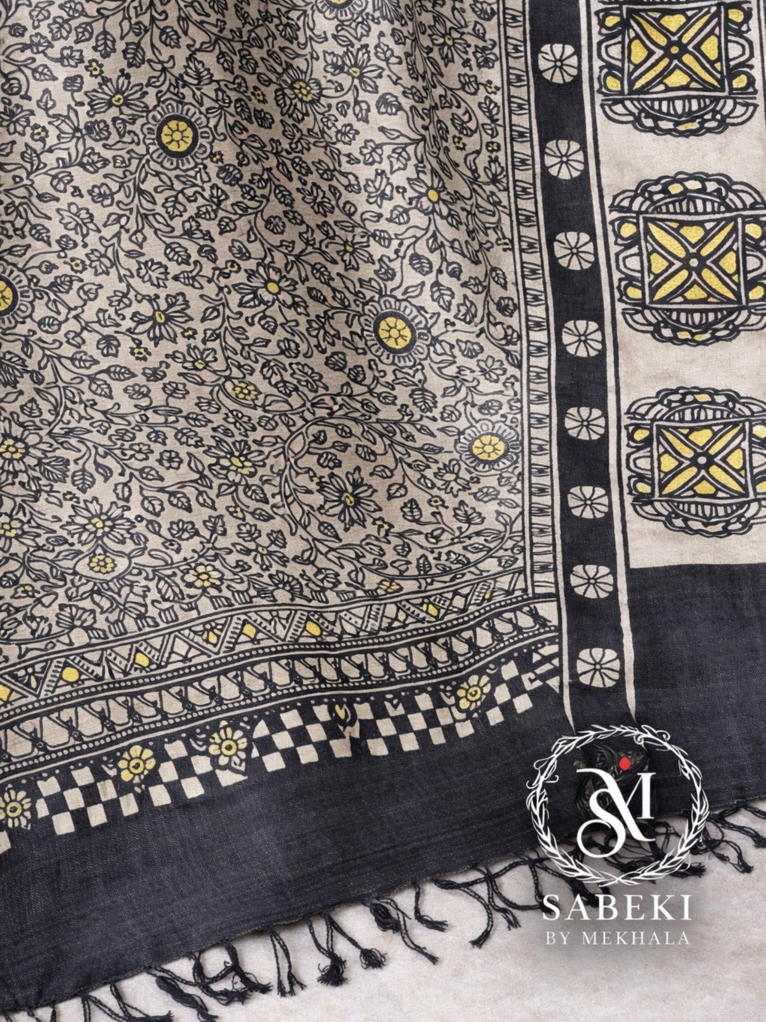 Close-up of hand-painted Madhubani artwork on silk