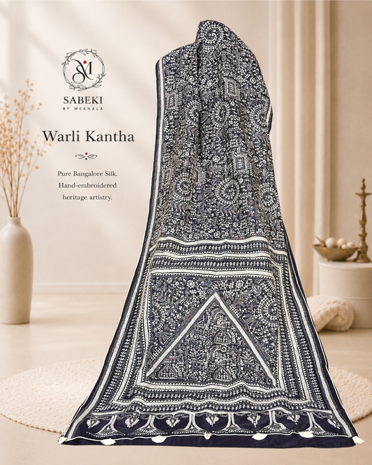 Hand embroidered Warli Kantha motifs on navy blue Bangalore silk saree with Sabeki By Mekhala logo